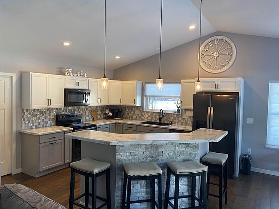 Eat-in kitchen with two-level island for entertaining