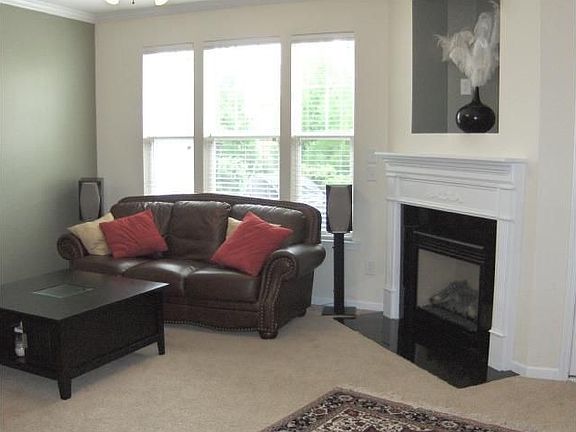The Family room has a gas fireplace with GRANITE & is open to the kitchen area