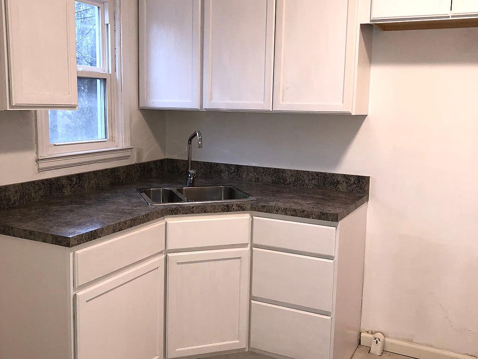 New cabinets counter tops and tile floor