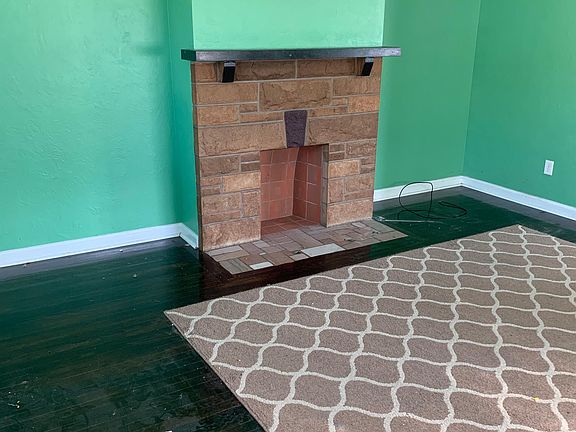 Living room with decorative fireplace