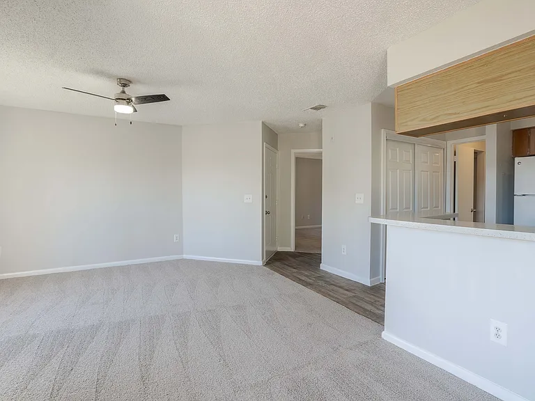 Experience contemporary comfort in this luminous living area ready to personalize.