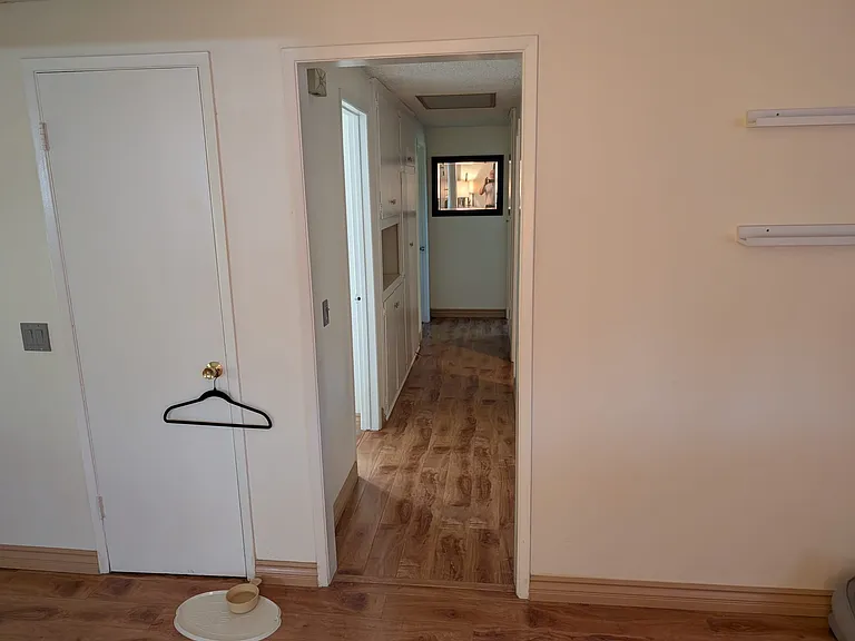 Hallway leading to three bedrooms