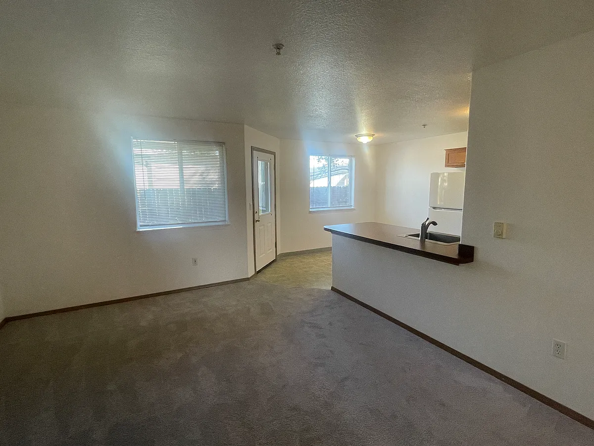Living room toward dining, back porch is out that door. - 2448 SE 117th Ave