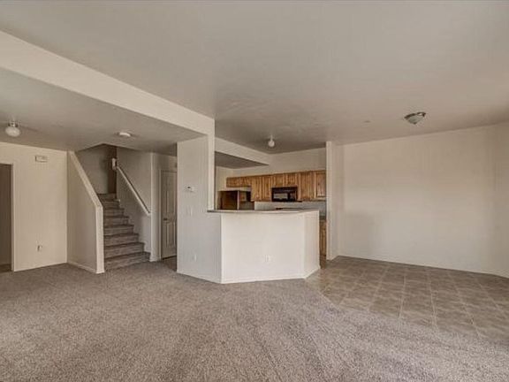 View from the livingroom Open concept, vinyl floor in dining area, extra storage. Lighting has been upgraded throughout the home.