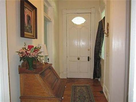 Entry Hall shows off original wood floors, doors and hardware.