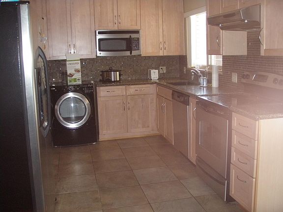 Updated kitchen with washer, dryer, dishwasher, range and Re