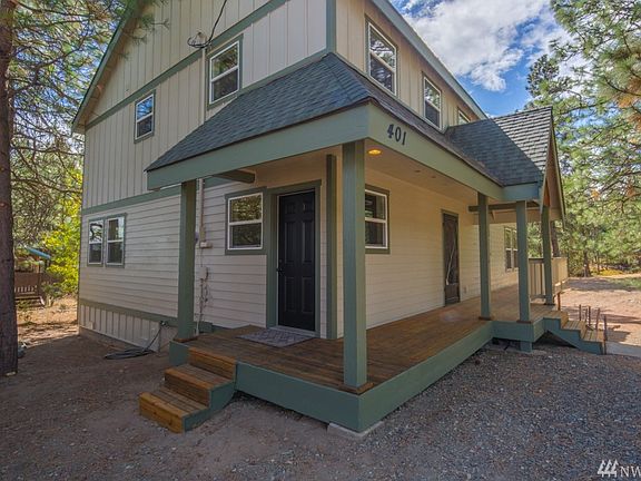 Covered porch leads to both the entry into the main living space or the mud room.