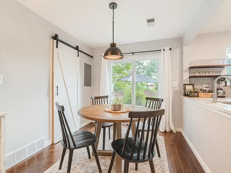 Charming dining corner with an outside view for an airy, indoor-outdoor vibe.