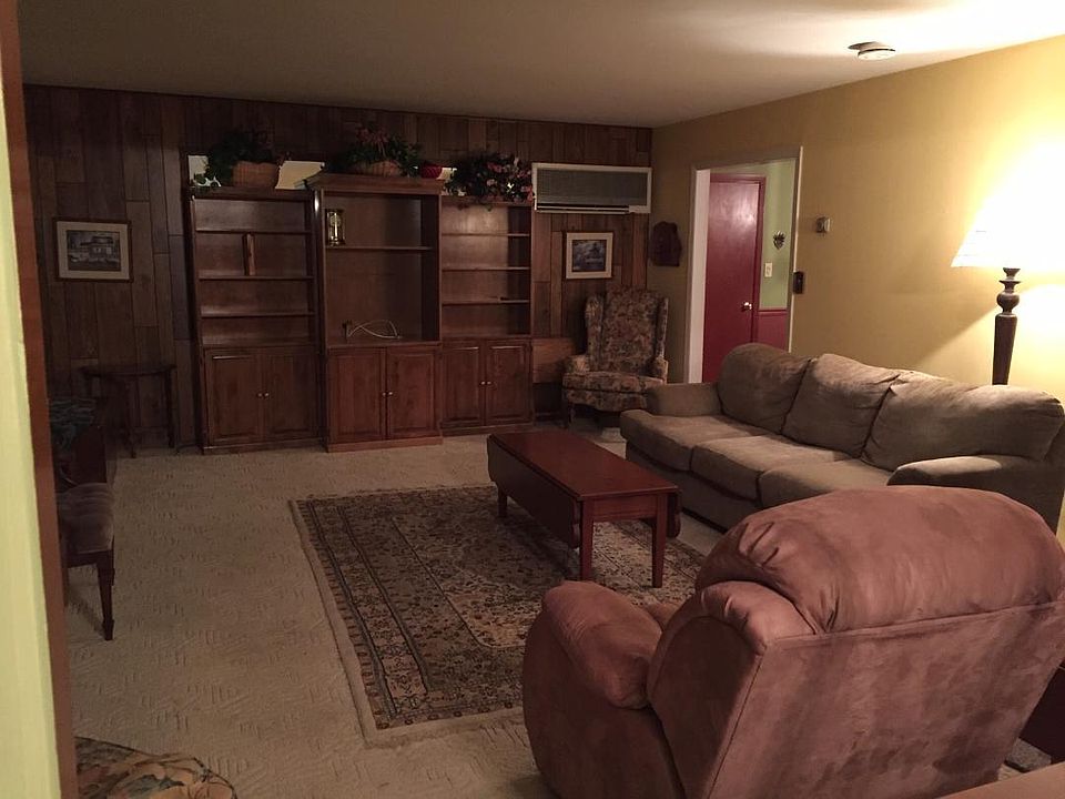 Very Large furnished Living room inside front door entry Neutral color pallet