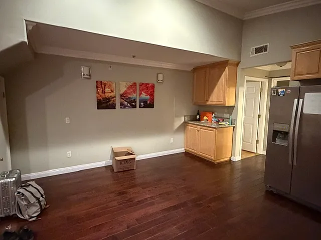 Versatile dining zone adjacent to the kitchen, complete with a built-in wet bar/serving station and dedicated storage.