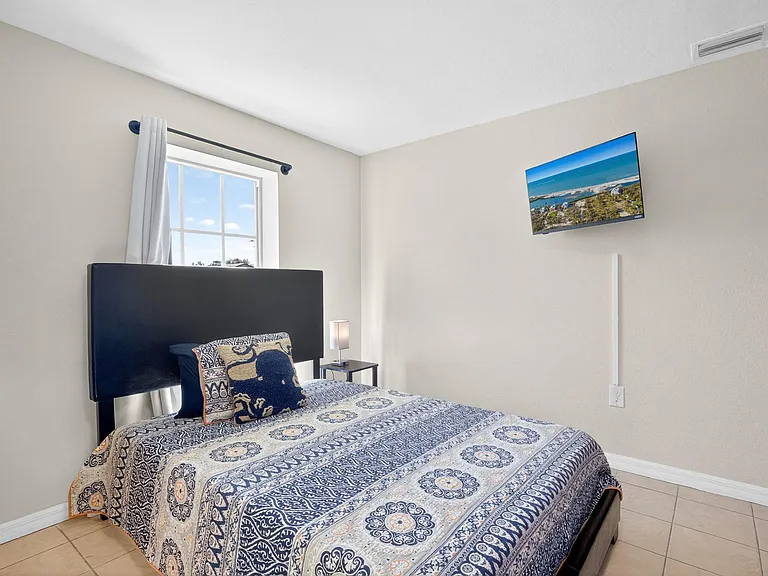 Bedroom 2 Featuring a Full-Size Bed and Lots of Natural Light