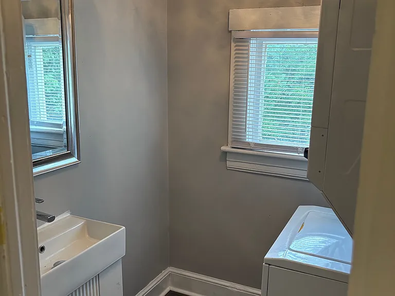 Completely Renovated Half Bath! New Luxury Vinyl Tile, New Vanity, Mirror, Crystal Lighting Fixture, Floating Shelves and NEW Stackable Washer/Dryer!