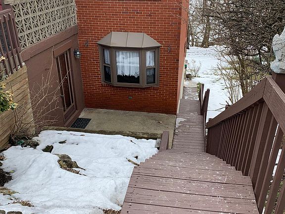 Front Entrance (steps leading down to the front entrance and back porch/backyard)