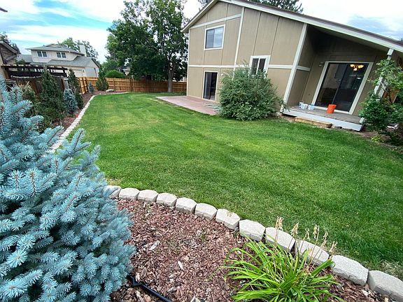 Backyard and covered deck and patio