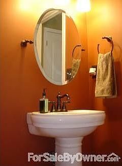 Bathroom : Features new toilet, pedestal sink, and mirror. Washer and dryer in closet.