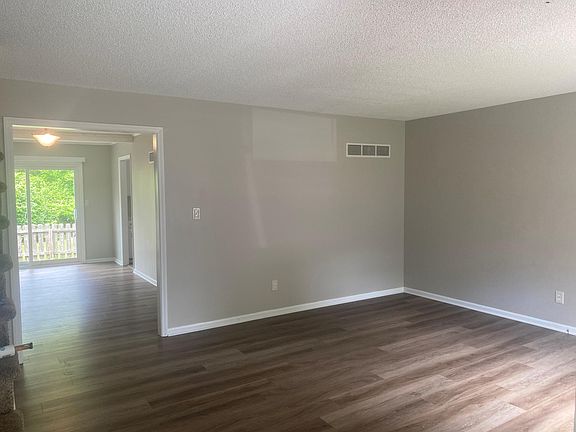 3RD VIEW OF LIVING ROOM AGAIN LOOKING AT DINING ROOM AND DOOR WAY TO KITCHEN