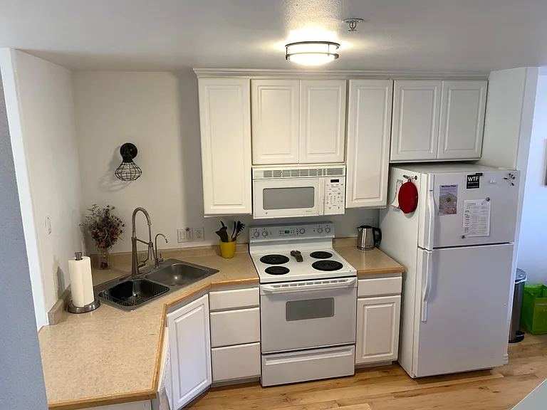 Fully stocked kitchen with cookware, dishes, etc.