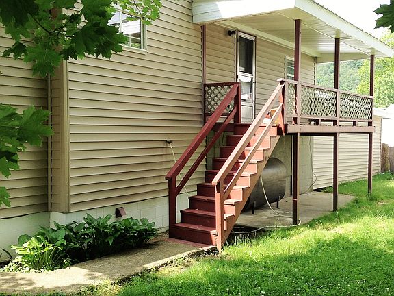BACK HOUSE CEMENT DECK UNDER PORCH