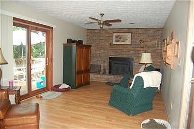 Spacious Family Room w/ceiling fan, fireplace with insert, walk out to deck 