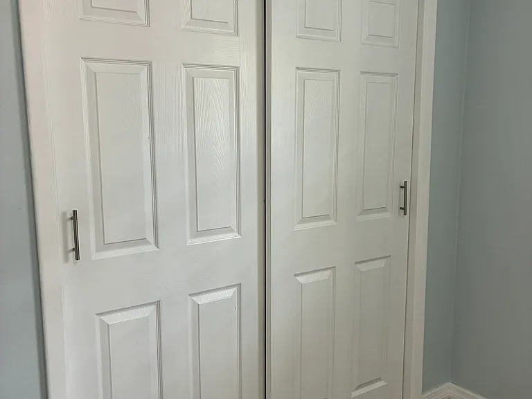 double closet in bedroom with built in