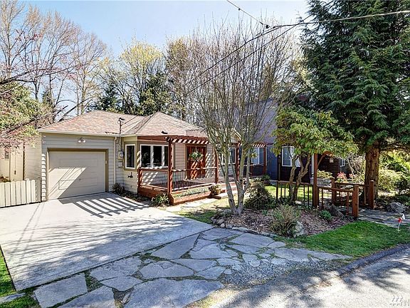 Home with generous one car garage and additional parking for two cars.