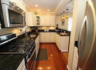 fully equipped kitchen with granite countertops