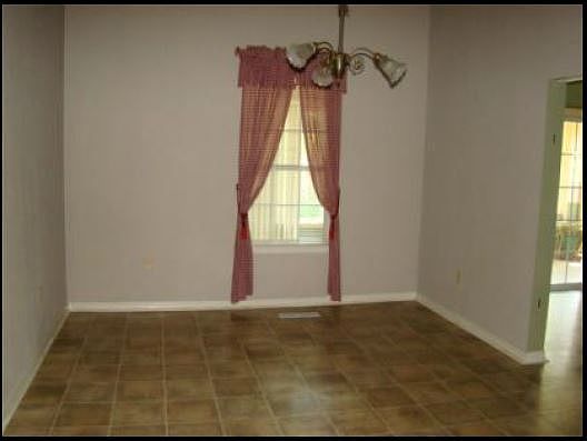 Dining Room
						:
						Antique light fixture in dining room