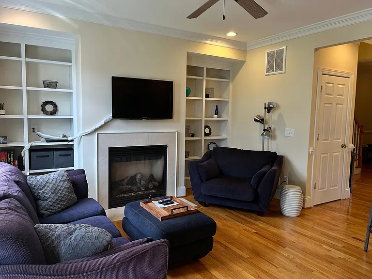 Living area with gas fireplace and TV
