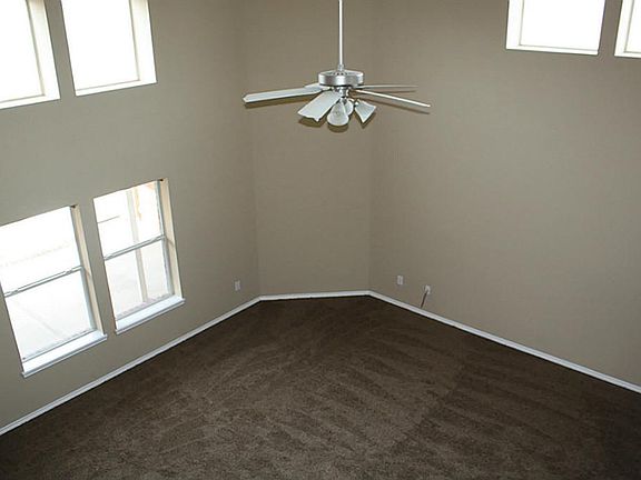 View of the family room from the 2nd floor. Windows offer natural light.