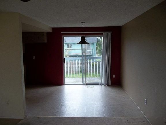 Dining room with slider out to deck overlooking backyard