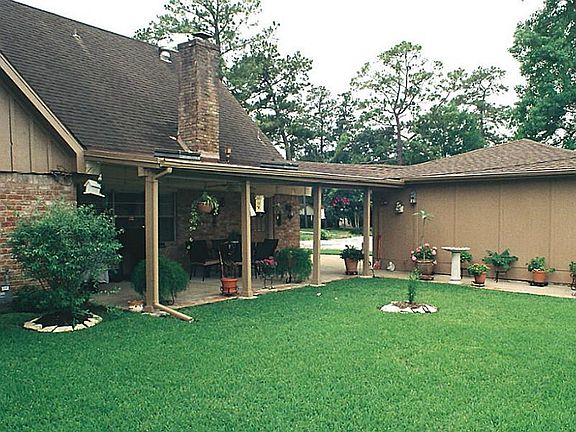 View of the back porch and landscaping close to the home