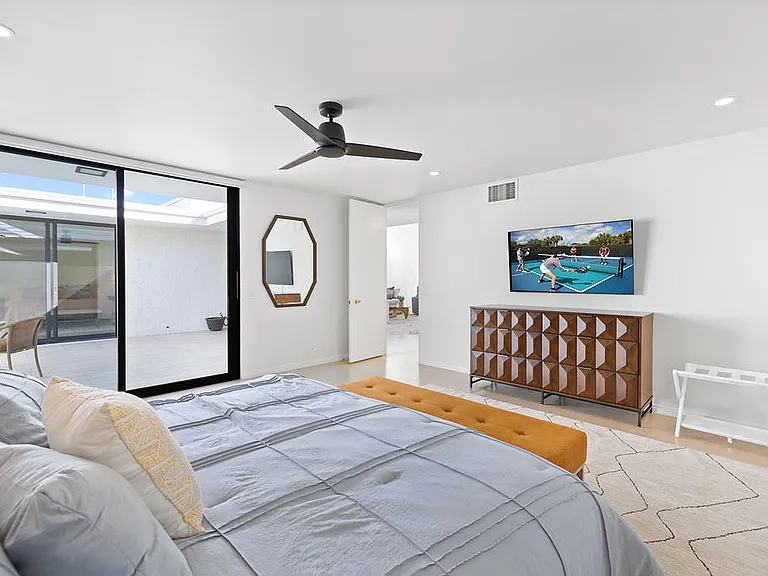 PRIMARY BEDROOM SUITE HAS ACCESS TO THE PRIVATE COURTYARD