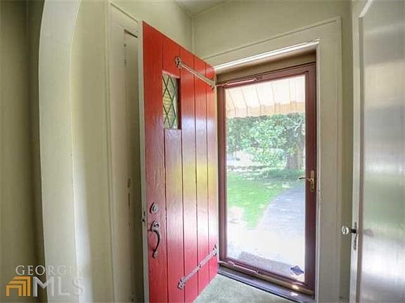 From the covered rocking chair front porch enter into this charming home!