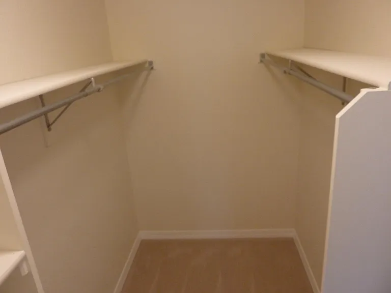 Master bed walkn-in closet with shoe rack