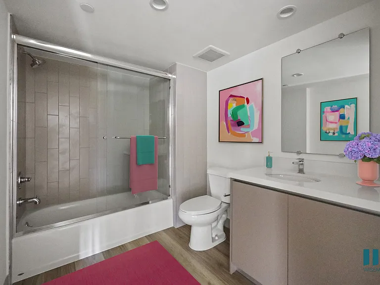Bathroom with Shower-Bath with Glass Door and Vanity Cabinet Storage