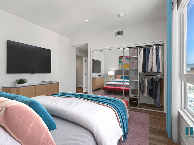 Bedroom with Large-Size Windows, Mirrored Closet, and Vinyl Flooring