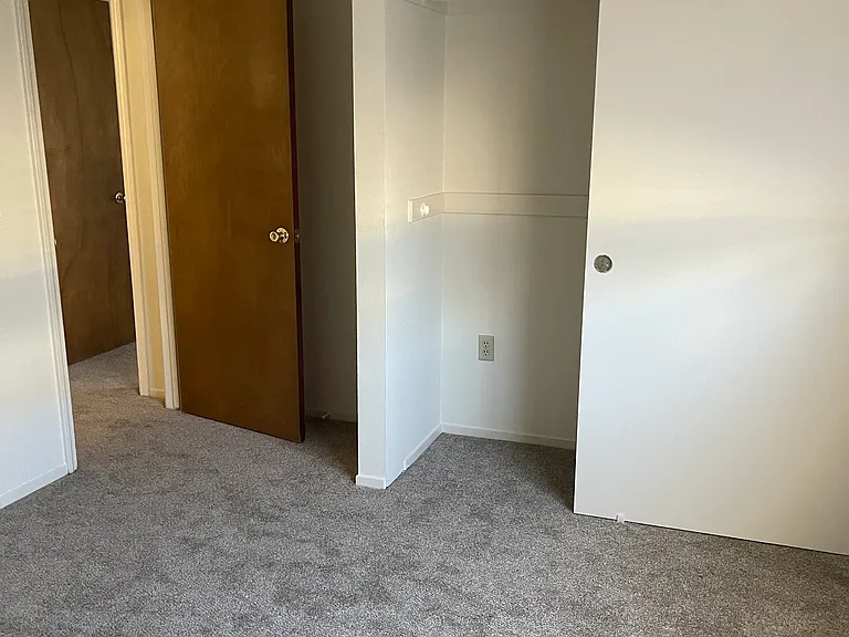 SECOND BEDROOM WITH NEW CARPETING