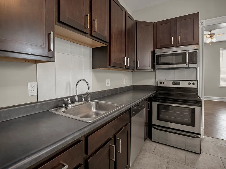 Microwave, dishwasher, disposal, tall cabinets for extra storage