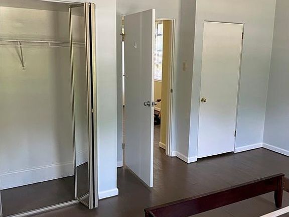 Pale Blue Bedroom with 2 Large Closets, one with storage above.