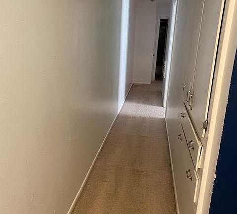 Main floor hallway with built in pantry