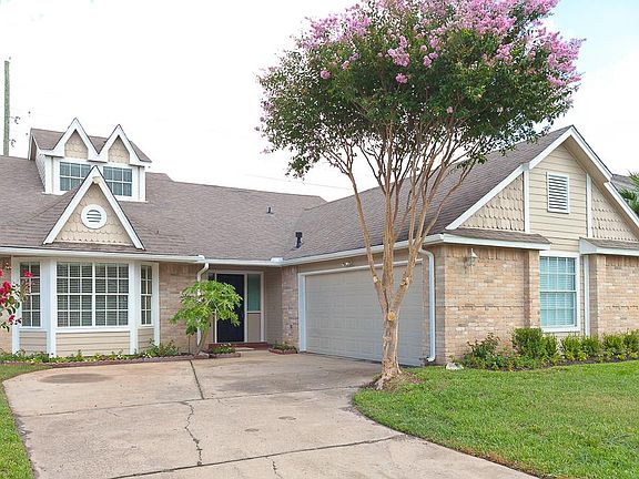 Two car garage and a covered front entryway.