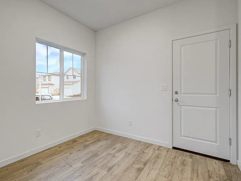 garage entrance to kitchen with dining section