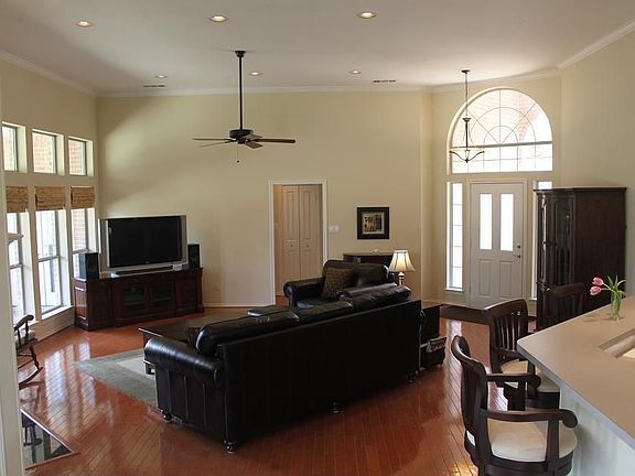 Spacious Living Area Includes 12' Ceilings and Crown Molding