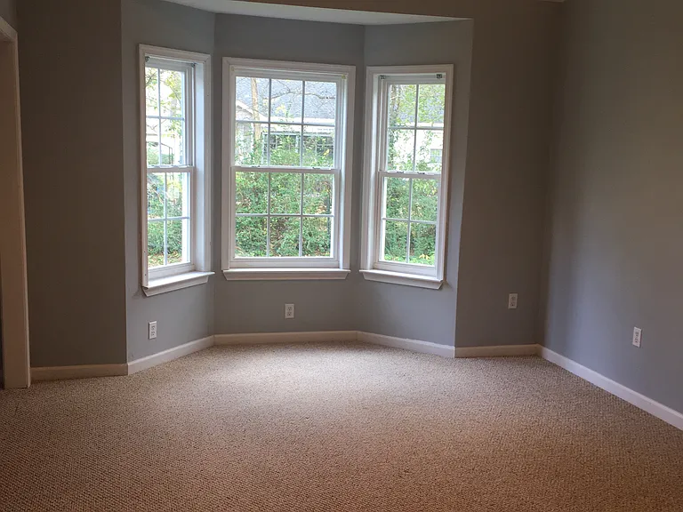 Large master bedroom with plenty of natural light.