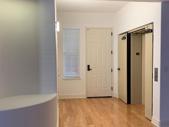 Front entry door and elevator to the unit from Garage