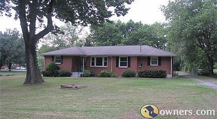 Front view of house with a beautiful spacious yard