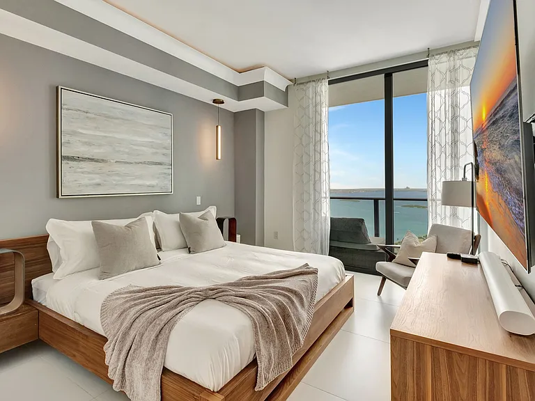 Master Bedroom / Enjoy Unobstructed water views and access to the Balcony from every room.