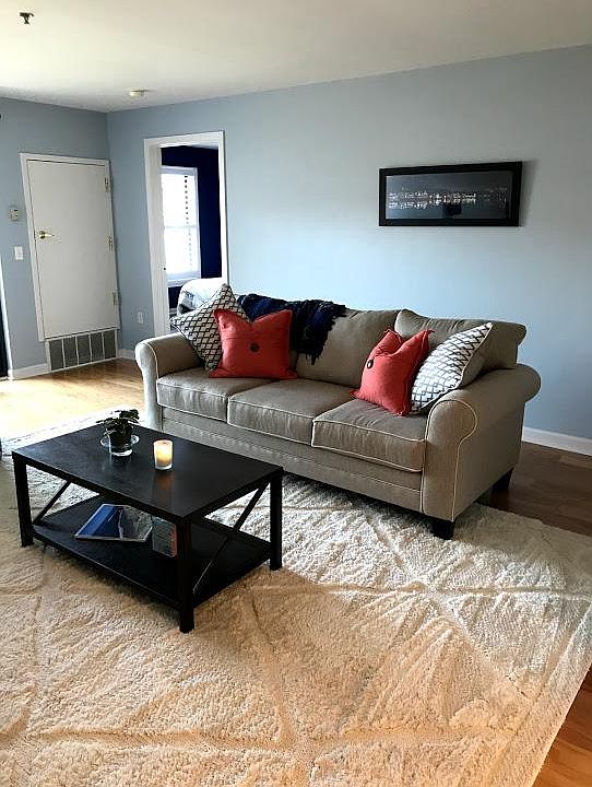 Living room that opens to the kitchen and balcony