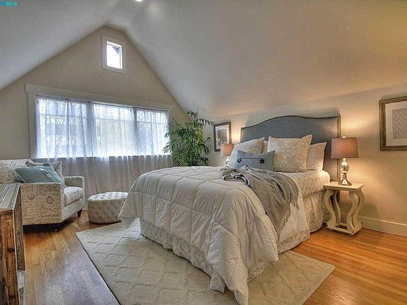 lovely upper unit with high ceiling and closets in both bedrooms. The second bedroom is a bit smaller than this one. Each bedroom has its own bathroom.