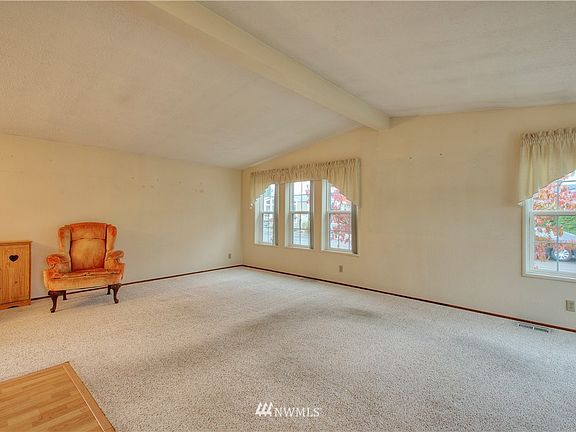 Enter to hardwood floors and open concept living room. 
